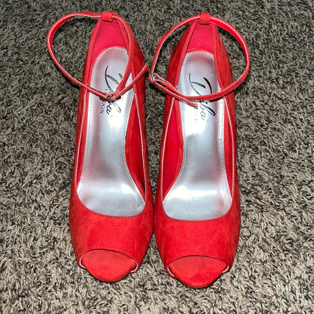 Red heels with strap around the ankle!
